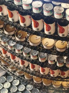 Cans on Metal Belt of an IJ White Mass-Tier Spiral System