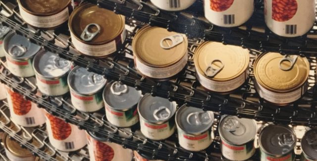 Cans on Metal Belt of an IJ White Mass-Tier Spiral System Cans on Metal Belt of an IJ White Mass-Tier Spiral System