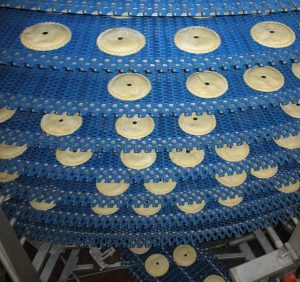 Pies on Ultra Series Spiral System on a blue plastic belt